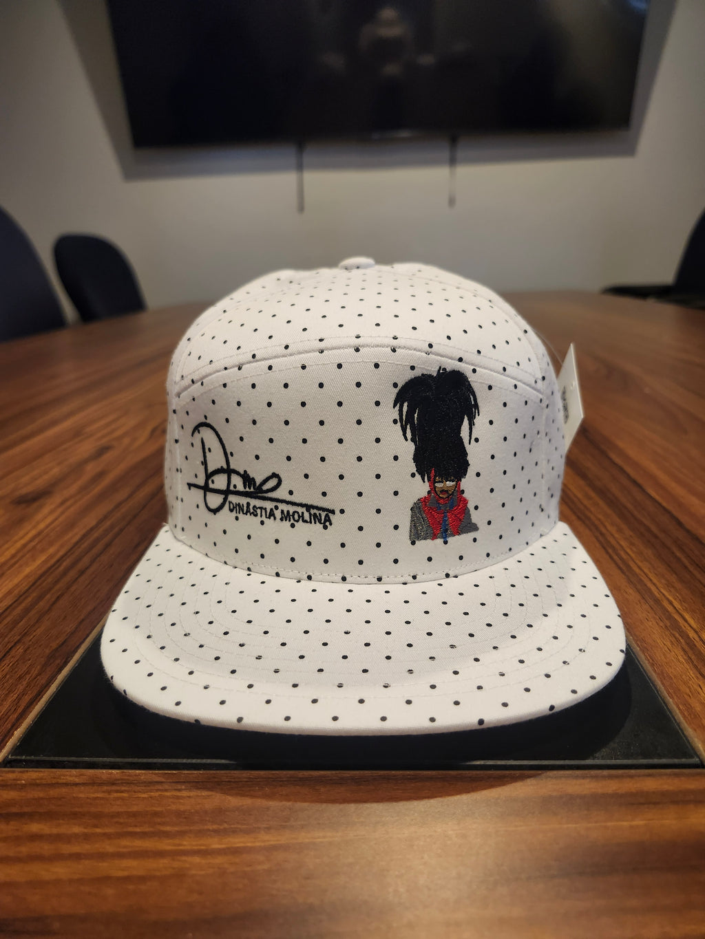 DM wearing a feathered hat