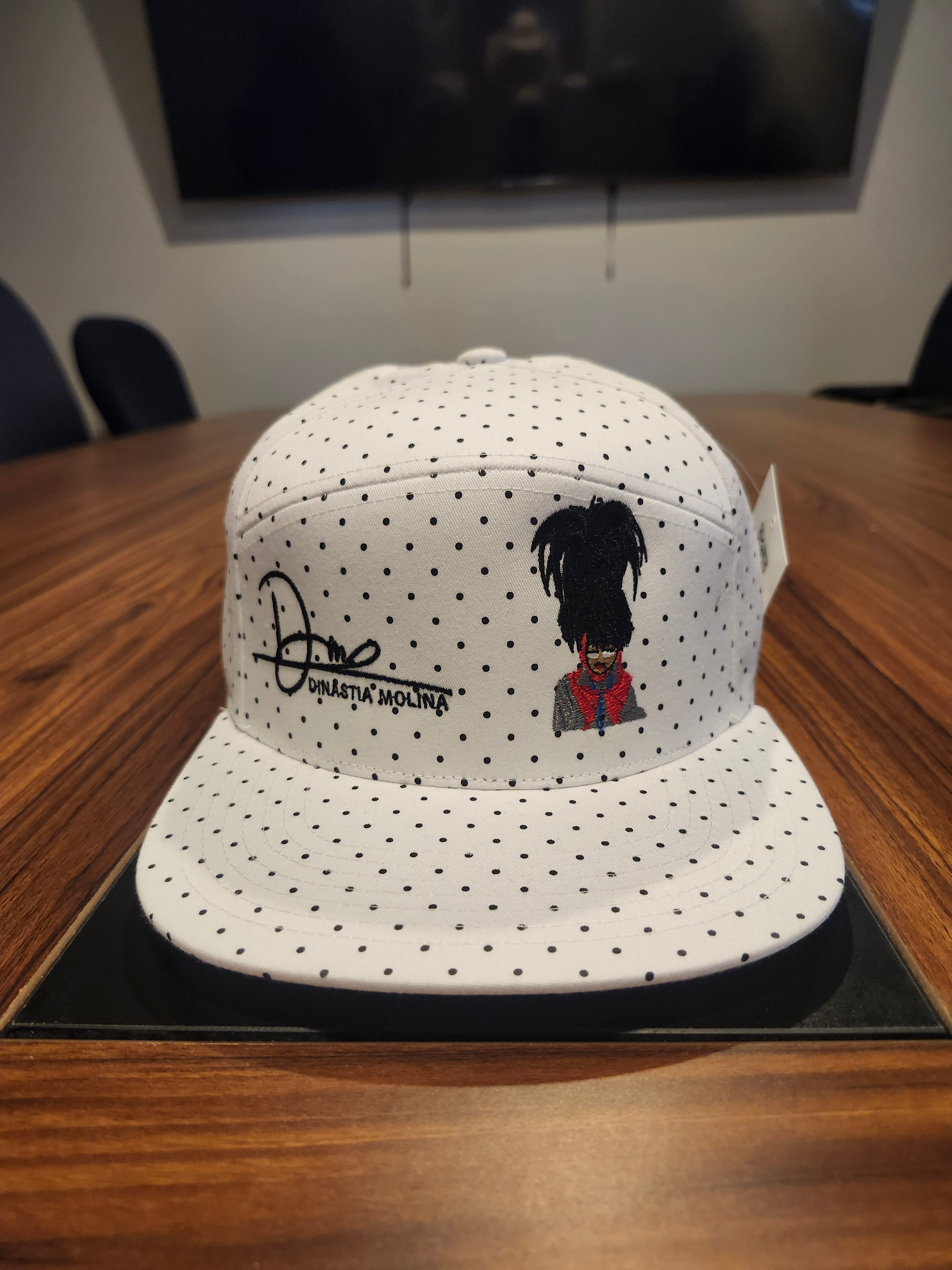 DM wearing a feathered hat