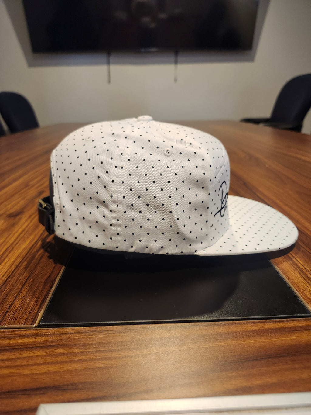 DM wearing a feathered hat