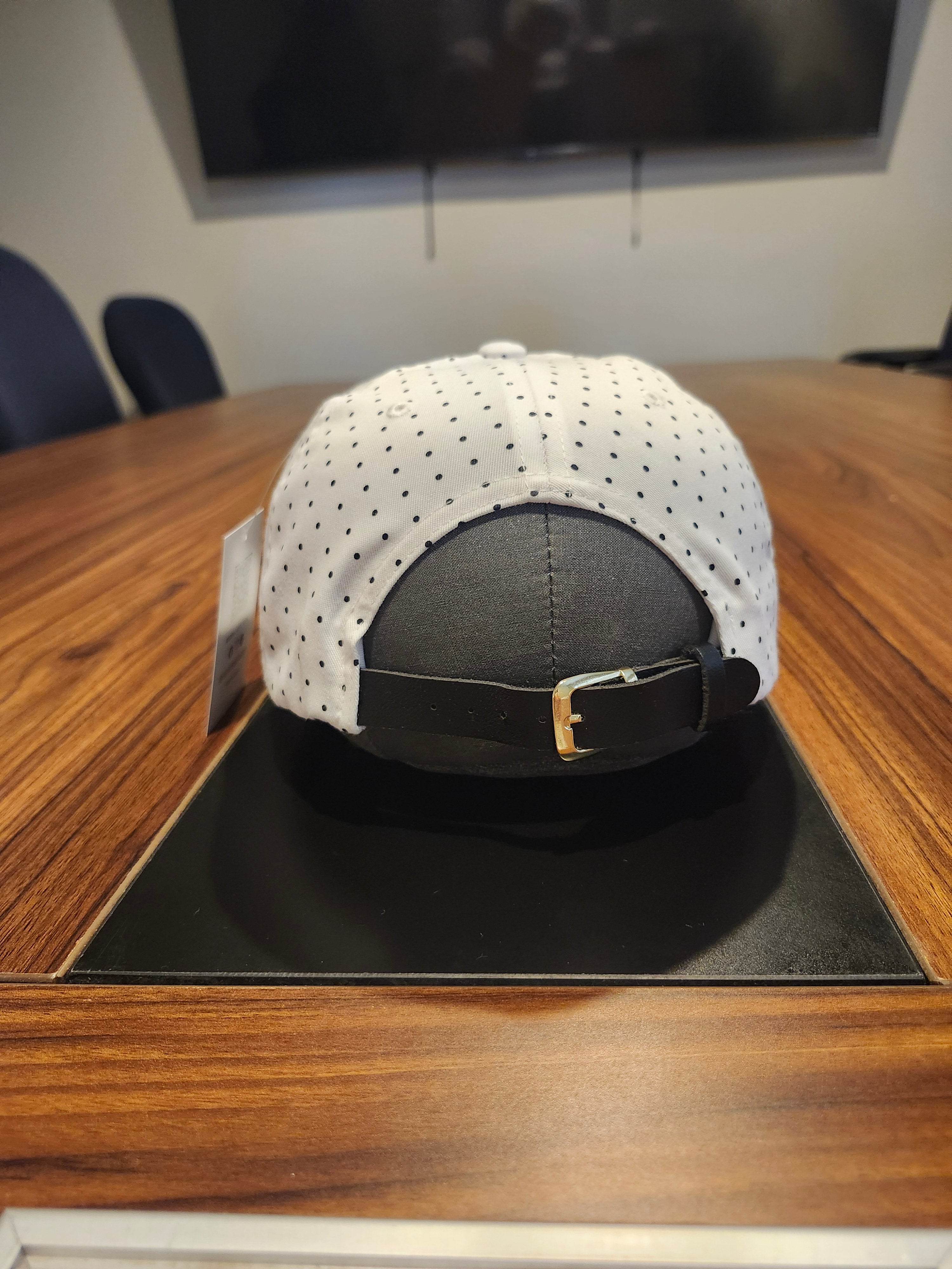 DM wearing a feathered hat